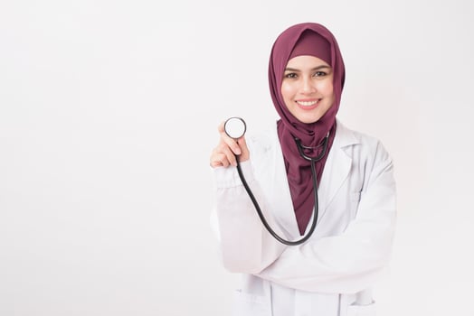 Beautiful woman doctor with hijab portrait on white background photo