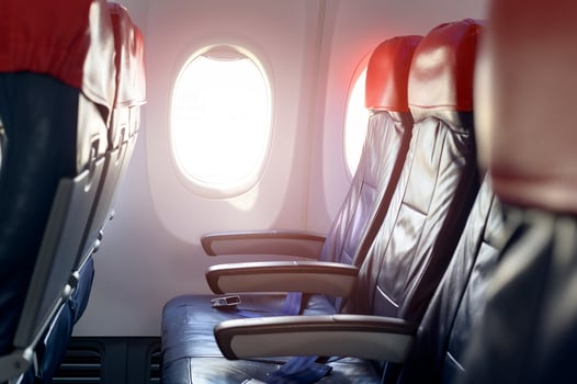 Aircraft cabin with empty passenger rows of seats. photo