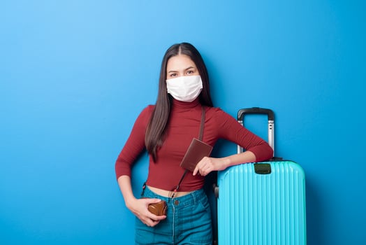 portrait of young traveler woman with face mask , New normal travel concept photo