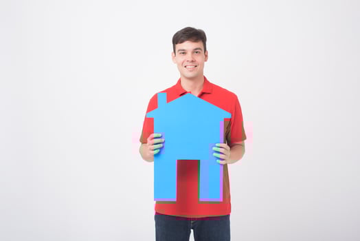 Portrait of handsome man is holding paper home on white background photo