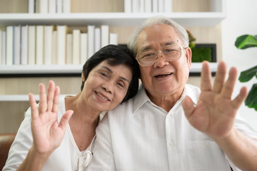 An Asian happy seniors elderly are video calling , relax at home, smiling healthy senior retired grandparents, older grandparent technology concept photo