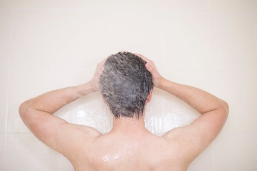 A man is taking a shower photo
