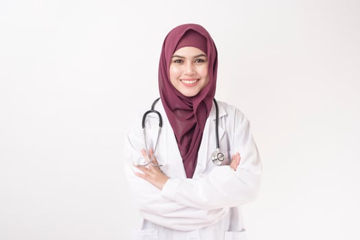 Beautiful woman doctor with hijab portrait on white background photo