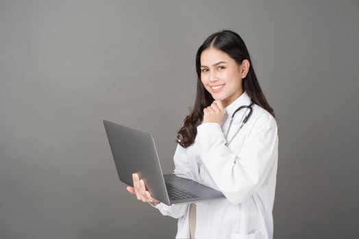 Woman Doctor is using  laptop photo