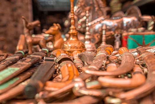 Assortment of metal swords, knives and daggers for sale in the Souk photo