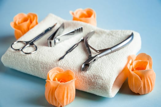 Tools for manicure and nail care on blue background. photo