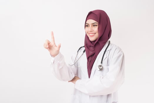 Beautiful woman doctor with hijab portrait on white background photo