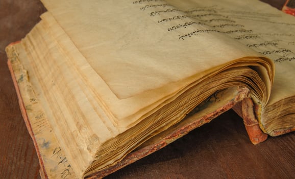 Ancient open book in arabic. Old arabic manuscripts and texts photo