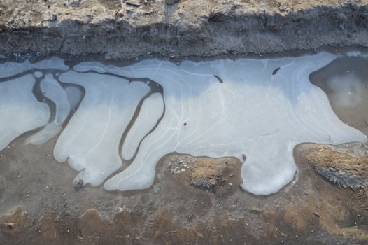 Ice texture on the ground winter patterns photo