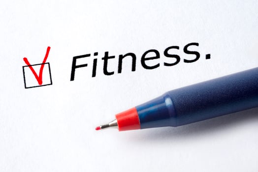 The word fitness is printed on a white background. photo