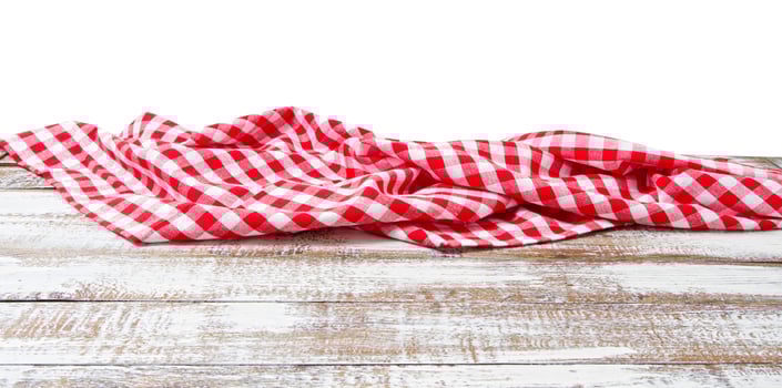 chekered tablecloth on empty table isolated on white background copy space photo