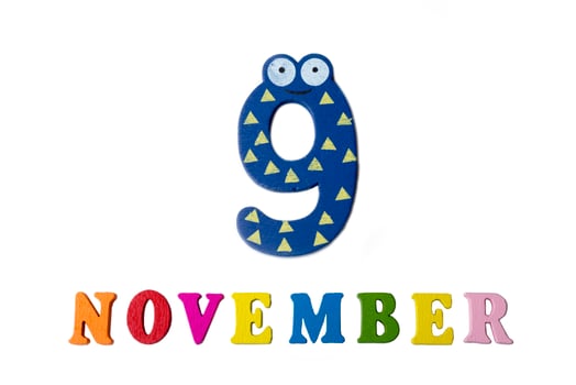 November 9 on white background, numbers and letters. photo