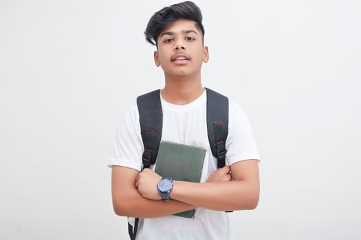 Young indian student holding diary file in hand. photo