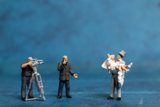 Miniature people Couple live stream marriage ceremony concept photo