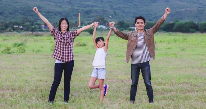 Happy little girl e with asian family  enjoying road trip and summer vacation photo