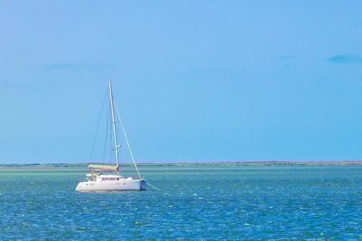 Luxury travel with yacht on Holbox island turquoise water Mexico. photo