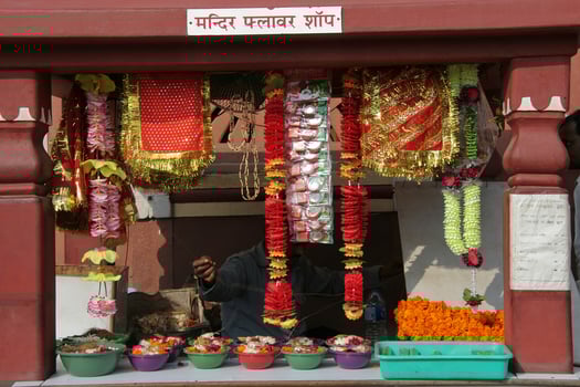 Stall with garlands and trays of flowers photo