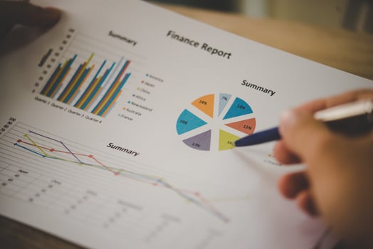 Businessman holding and analyzing investment chart working in office. Business work concept. photo