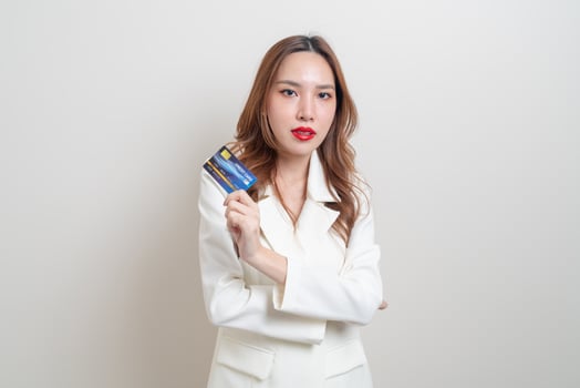 portrait beautiful Asian woman holding credit card photo