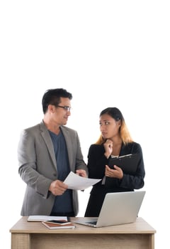 Young business woman standing with her boss conversation about the business at office isolated on white background. photo