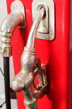 Old gas gun at a gas station in retro style. photo