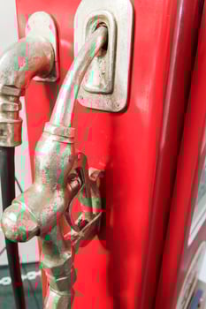 Old gas gun at a gas station in retro style. photo