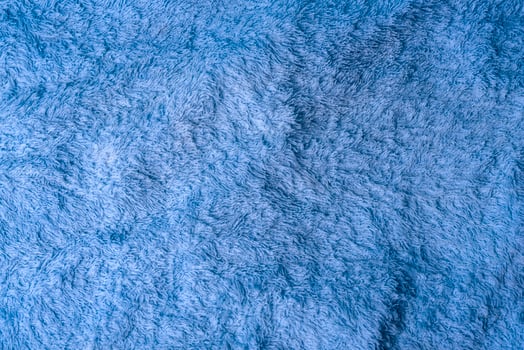 large towel cloth of soft blue terry texture rotates photo