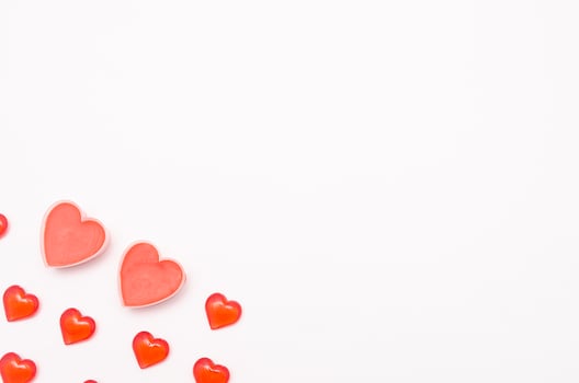 Valentine day background.Two big romantic valentine hearts and several hearts on white background photo
