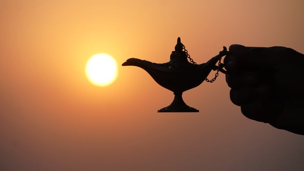 magical lamp in hand with sun jinee lamp magical concept photo