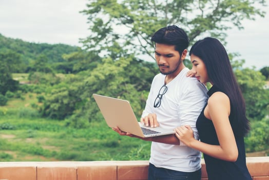 Young education couple talking about education after reading book with laptop ,Relaxing with nature. photo