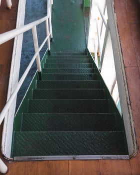 Deck of moored passenger transport ship on the embankment photo