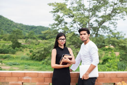Young education couple talking about education after reading book,Relaxing with nature. photo
