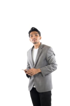 Businessman hipster holding  phone on isolated white background. photo