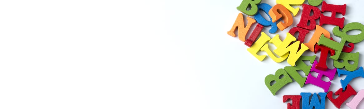 Wooden colored letters on a white background. Copy Space. photo