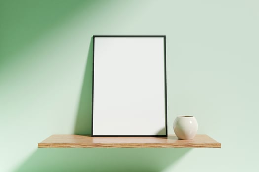 Minimalist vertical black poster or photo frame mockup with vase on a wooden shelf