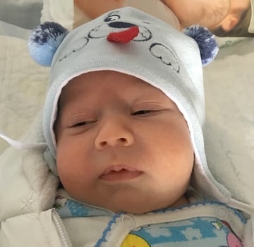 Beautiful baby boy with child face posing photographer photo