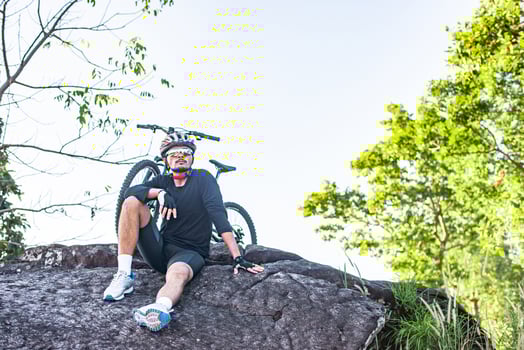 Athletes sitting on the mountain with bicycle photo