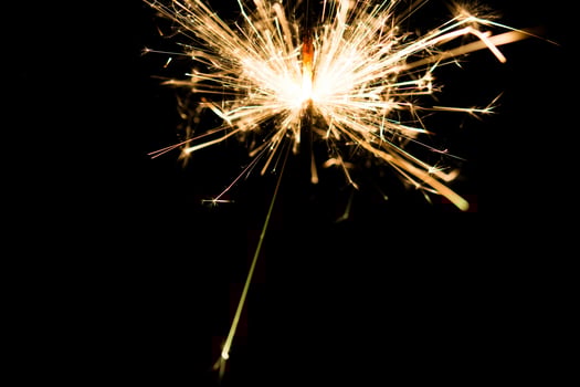 Christmas and newyear party sparkler on black photo