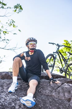 Athletes sitting on the mountain with bicycle photo