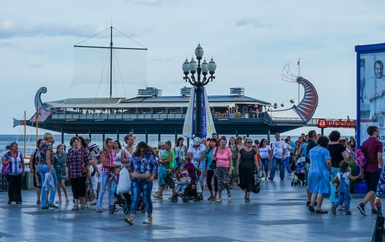 Yalta, Crimea-June 12, 2014 - People on the waterfront of the city on the background of the sea. photo