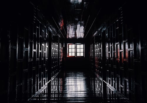 gloomy dark wooden corridor with closed doors of an empty hotel without people during quarantine photo