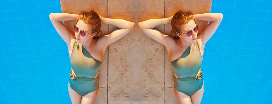 Beautiful woman chilling out by the swimming pool. Summer, recreation, travel concept photo