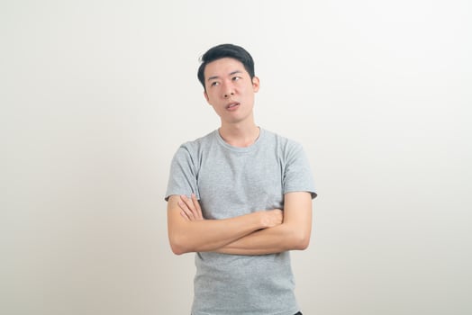 young Asian man with stress face or working hard photo