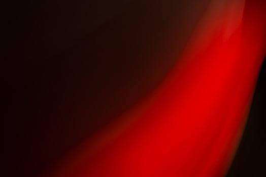 Abstract red light on a black background. photo