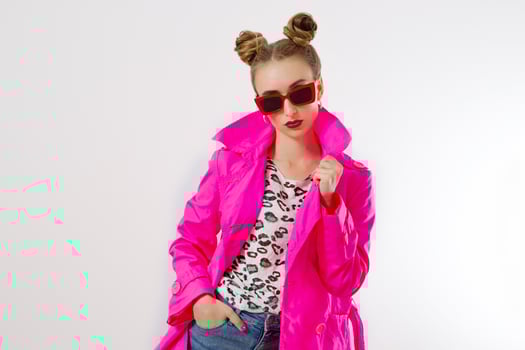 Happy, shock, excited woman face closeup. Girl in bright pink autumn clothes, red sunglasses isolated on white background, copy space. Beautiful female surprised, cheerful. Fun funny model screaming photo