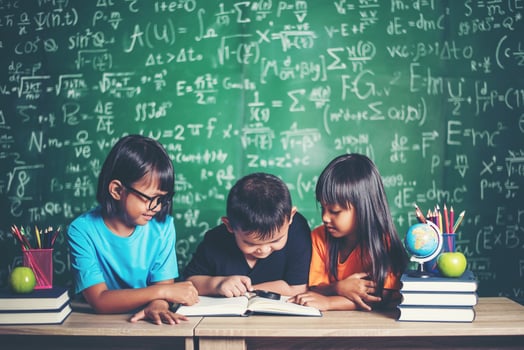 pupils  reading a book in the classroom. photo