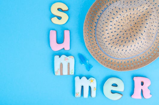Homemade cookies with summer theme on blue background. photo