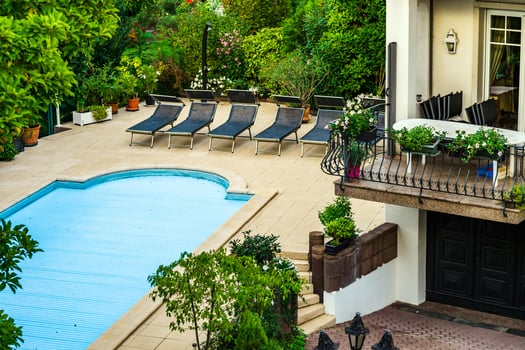 Private swimming pool aerial view, summer time photo