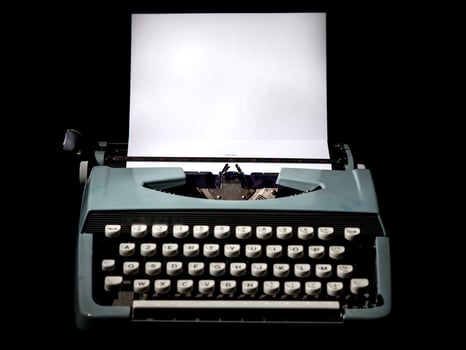 Vintage typewriter, writer or author's tool, inspiration and creativity. On a black background. photo