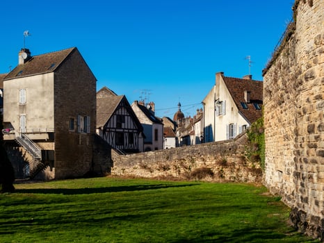 Beautiful ancient architecture of Burgundy. Streets of the city of Beaune. Sunny spring day. Advertising tourist types. photo